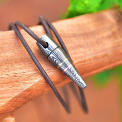 Bullet style pendant with adjustable leather cord