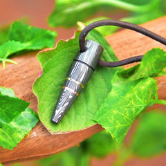 Bullet style pendant with adjustable leather cord